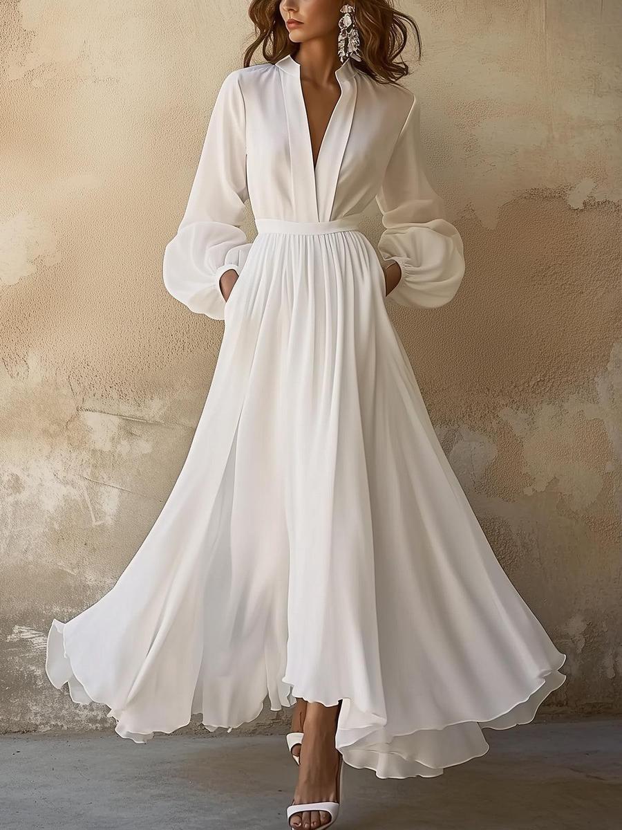 Ropa larga vintage blanca unida con cuello en V