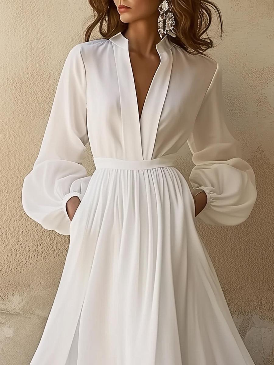 Ropa larga vintage blanca unida con cuello en V