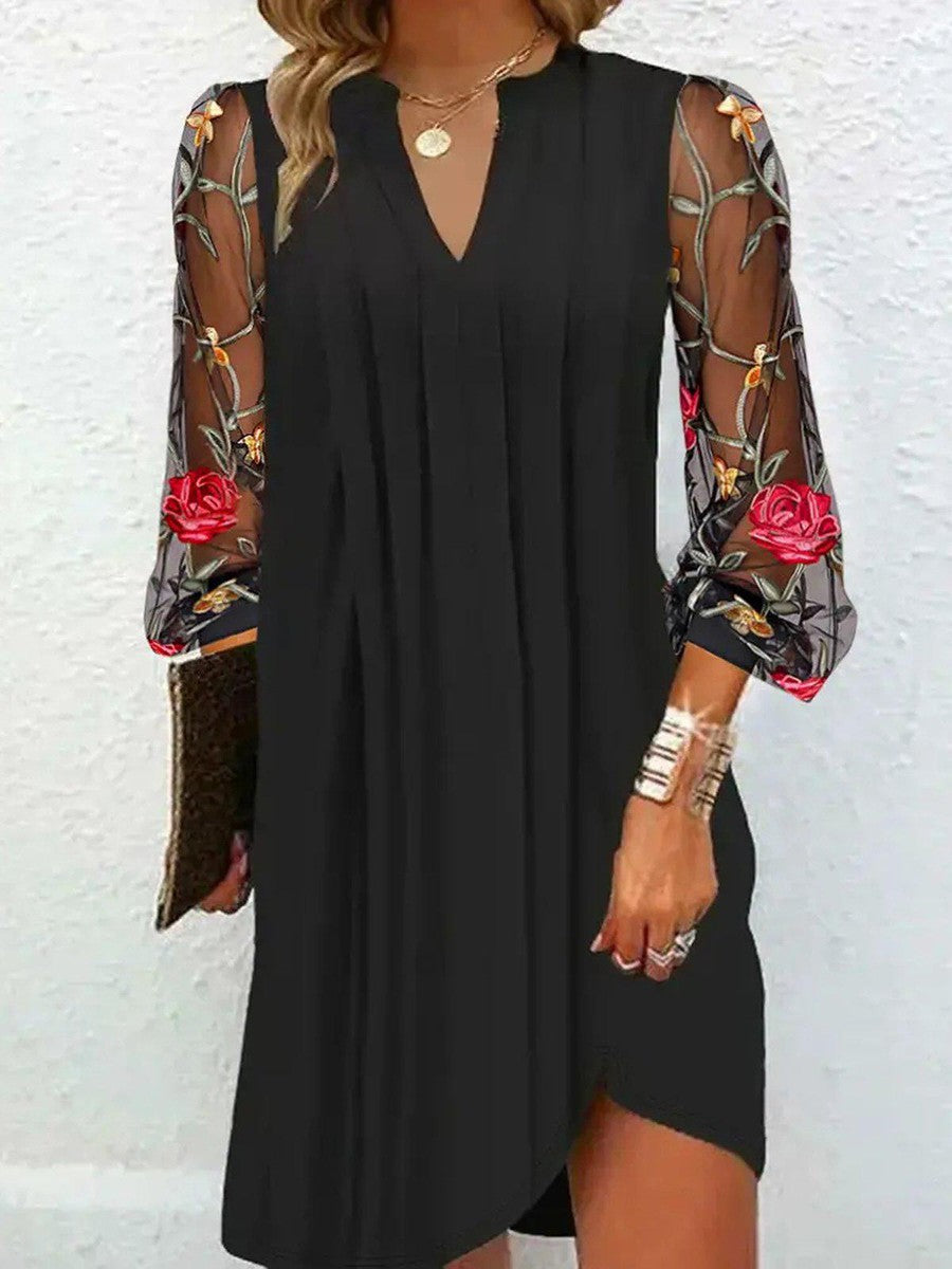 Julia Mini-vestido elegante con mangas transparentes y escote en V