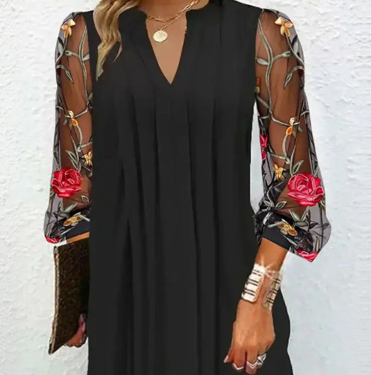 Julia Mini-vestido elegante con mangas transparentes y escote en V